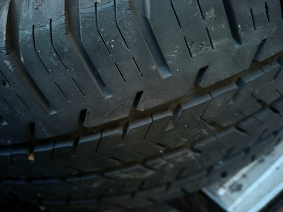 Close-up of a rugged tire tread showing durable design.