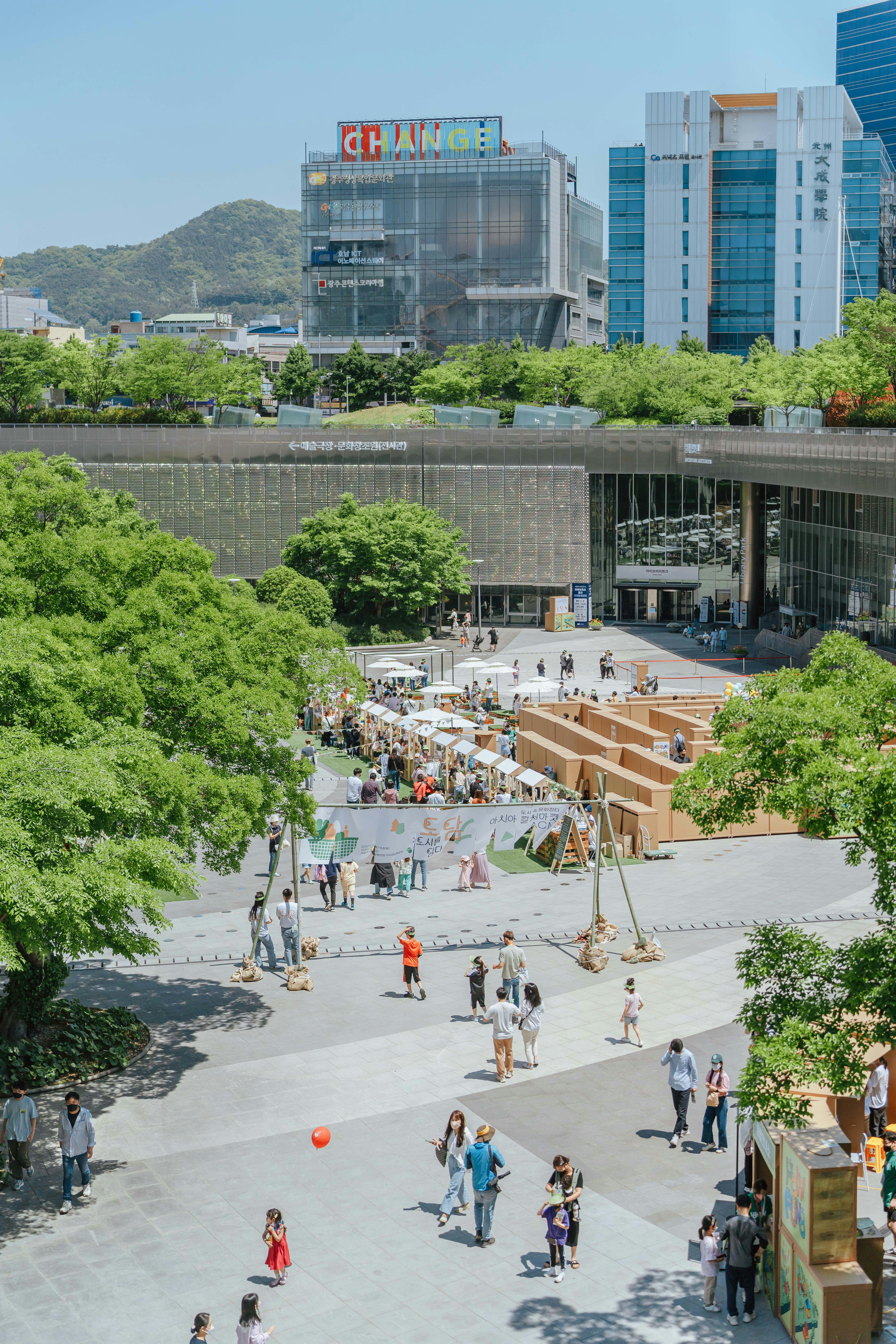 a group of people standing around in a courtyard