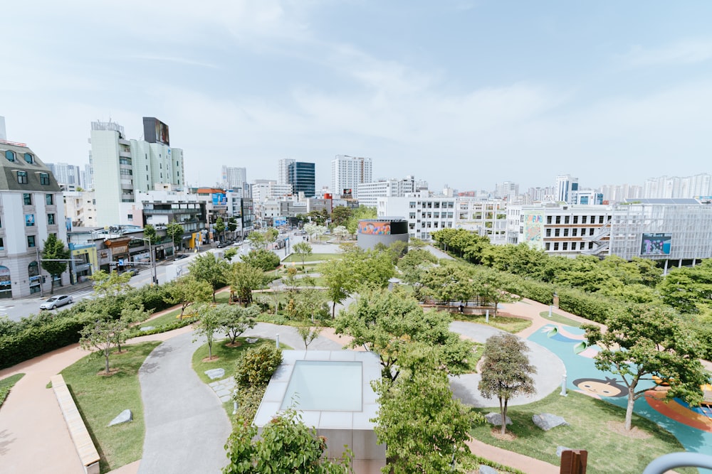 a view of a park with a swimming pool in the middle of it