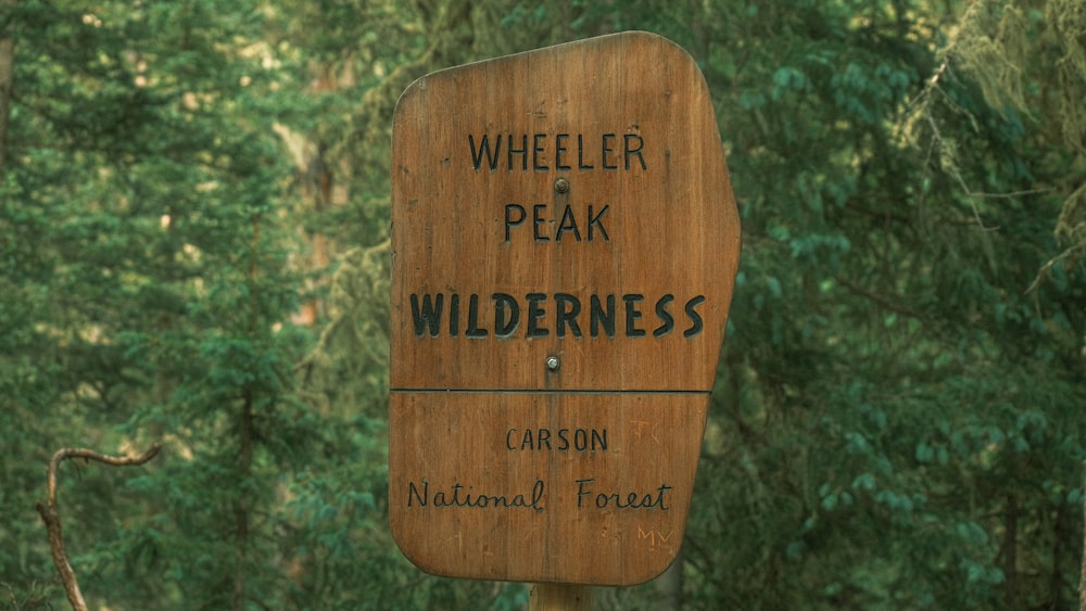 a wooden sign that says wheelerr peak wilderness