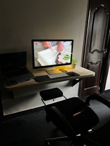 Technician repairing a desktop computer in a modern workspace