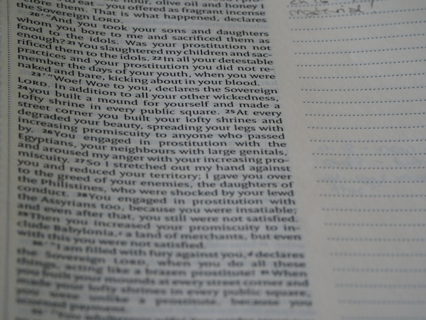 The image contains a close-up view of a printed book page with text primarily on the left side. The right side of the image has lined paper that appears to be a space for notes. The text includes religious and somber themes, visible in phrases like 'Sovereign LORD' and descriptions of practices and behaviors.