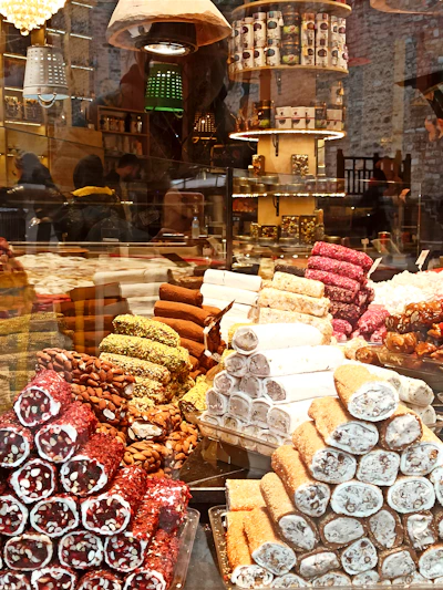 Elegant box of assorted Turkish delights wrapped in luxurious silk ribbon with intricate patterns.
