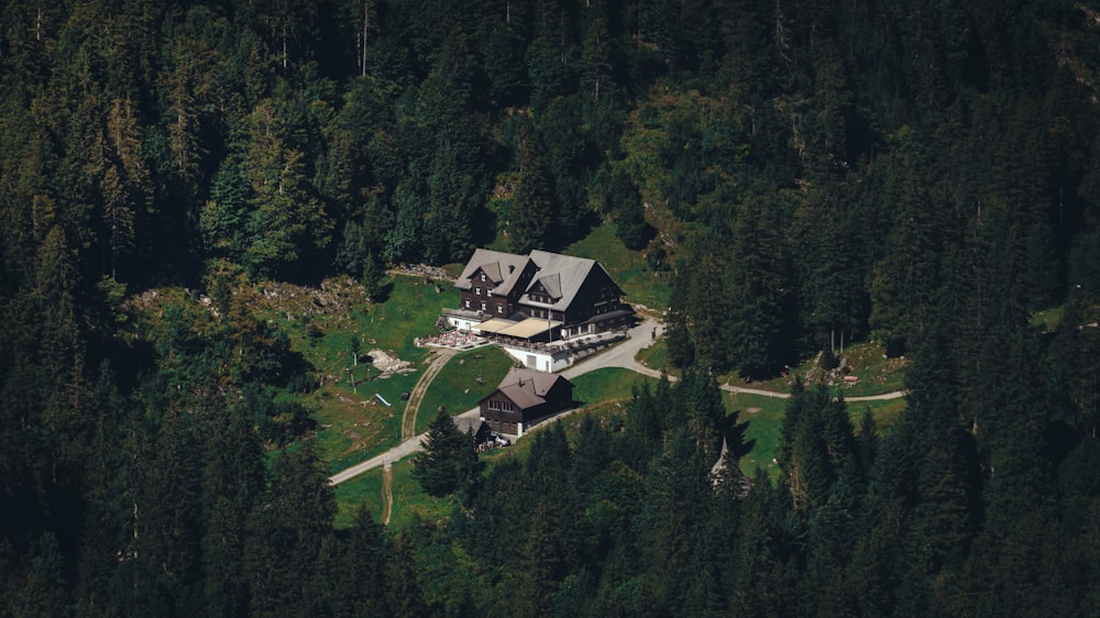 an aerial view of a house surrounded by trees