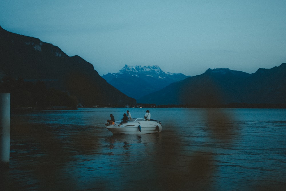 a group of people on a boat in the water