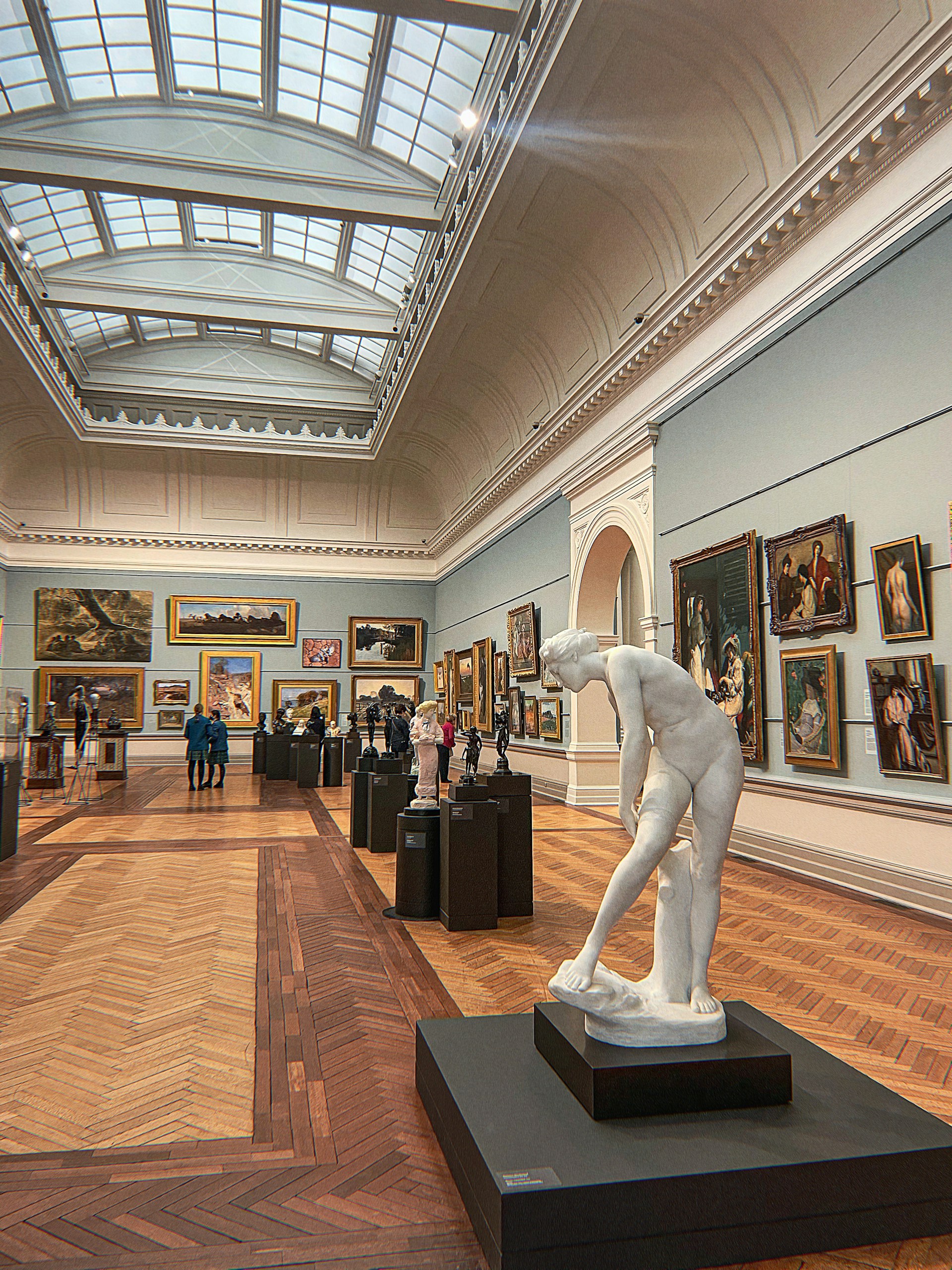 woman wearing yellow long-sleeved dress under white clouds and blue sky during daytime
