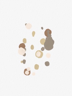 A collection of abstract shapes in various earthy tones such as beige, taupe, and brown, scattered over a light textured background. The composition is minimalistic with a sense of organic movement and soft edges.