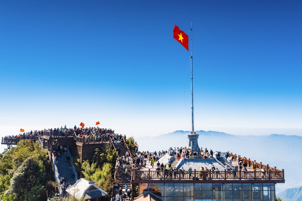 a group of people standing on top of a mountain