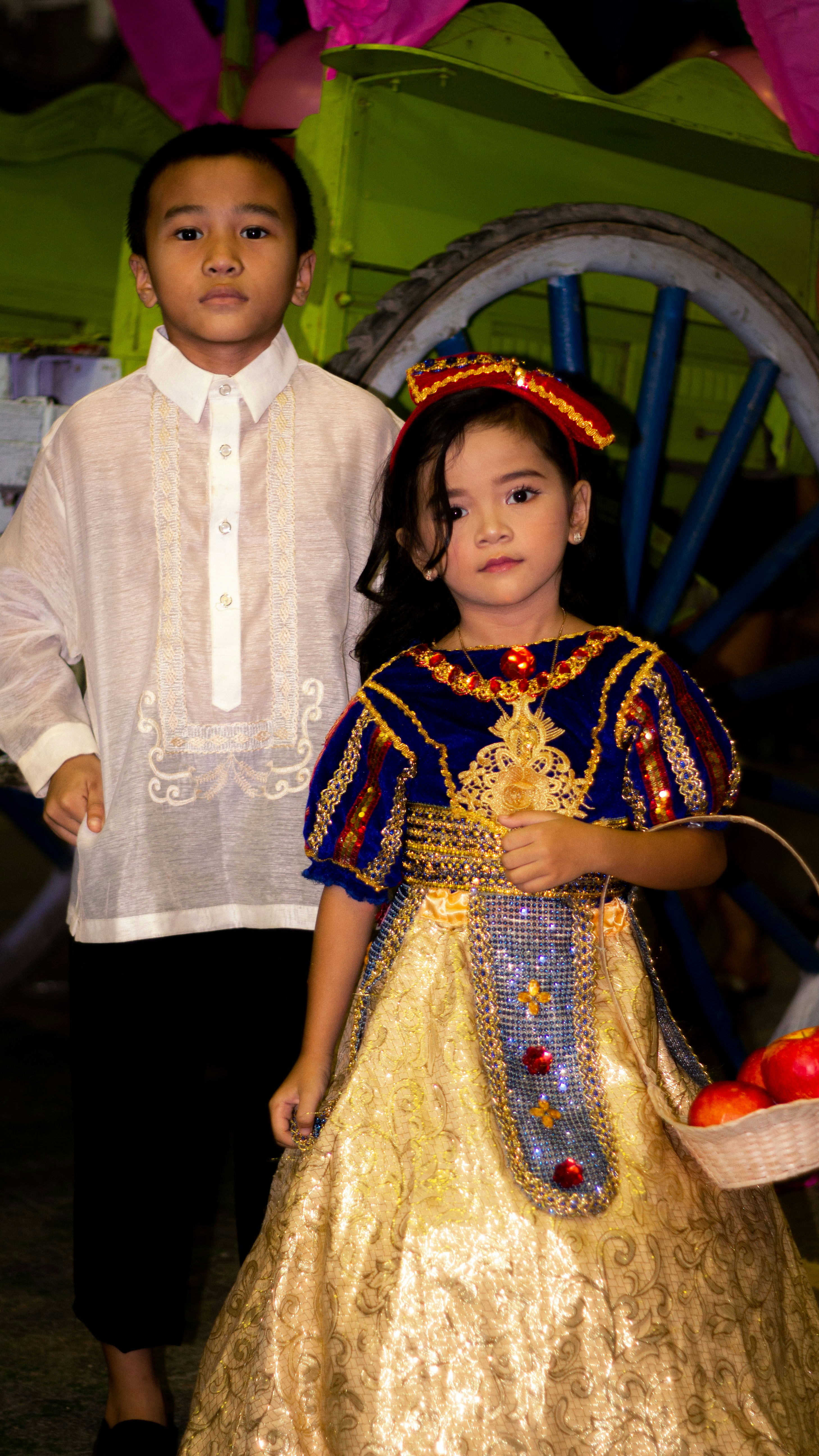 a boy and a girl dressed up in costumes