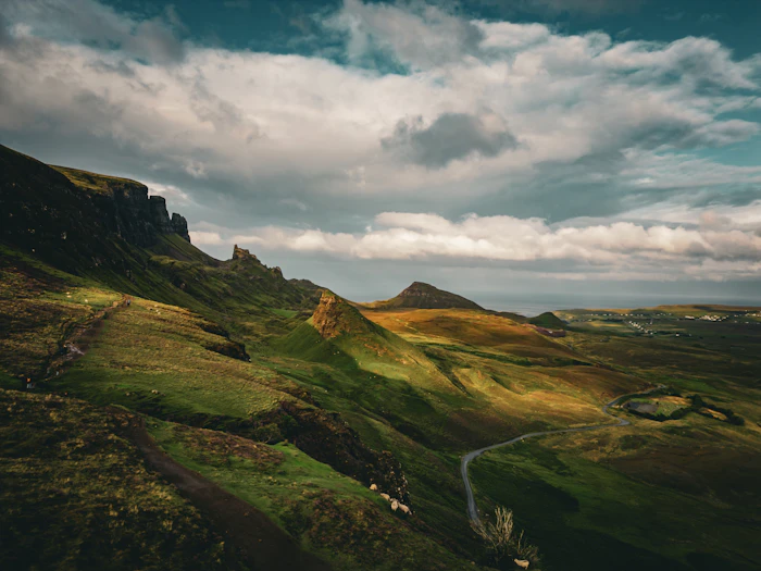 A dramatic Highland mountain landscape with winding road