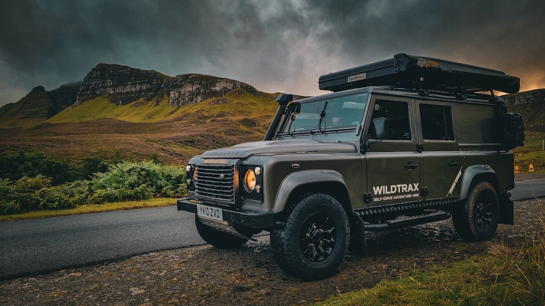 Wet Dark green Land Rover Defender, Quiraing - Isle of Skye, Scotland – Cotswolds digital marketing Stroud - Photo by Johnny Briggs | best digital marketing - London, Bristol and Bath marketing agency