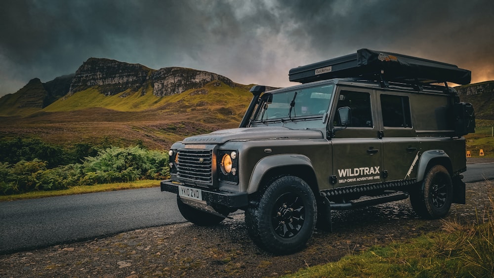 a land rover is parked on the side of the road