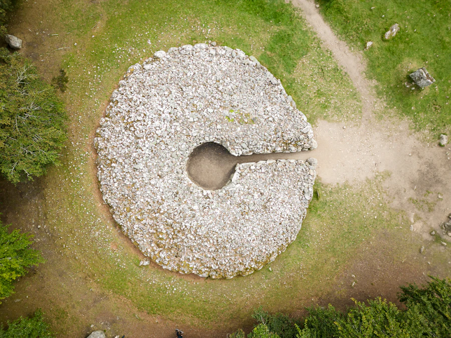Aerial view of a stone circle and cairn among the trees at Clava Cairns
