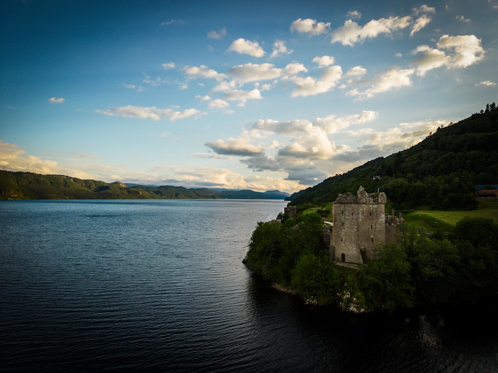 a castle on a small island in the middle of a lake