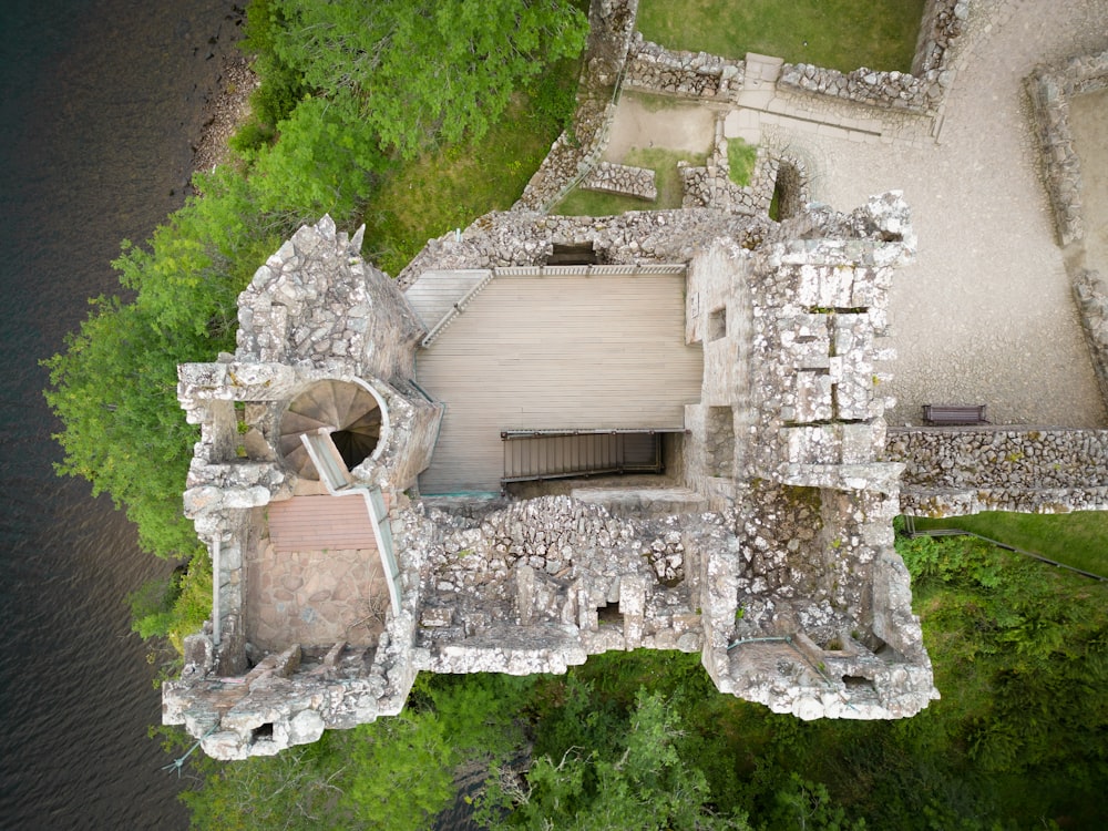 an aerial view of an old castle in the woods