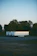 A Securesight Mobile surveillance trailer stationed at a bustling outdoor event at dusk.