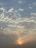 A serene sky with soft, glowing clouds at sunrise, symbolizing new beginnings.