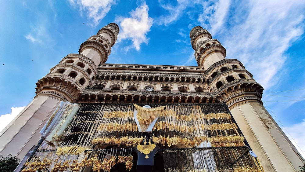 a tall building with lots of gold decorations on it