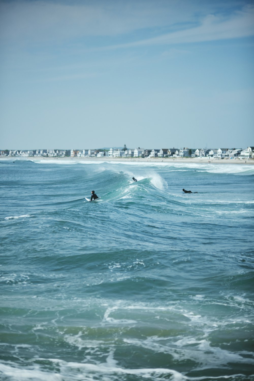 a person riding a surfboard on a wave in the ocean