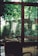 A serene outdoor setting with lush greenery and cozy seating.
