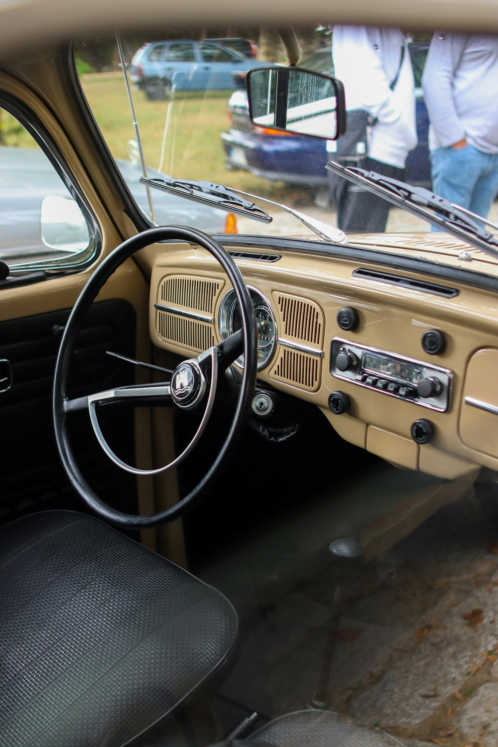 the interior of a car with a steering wheel and dashboard