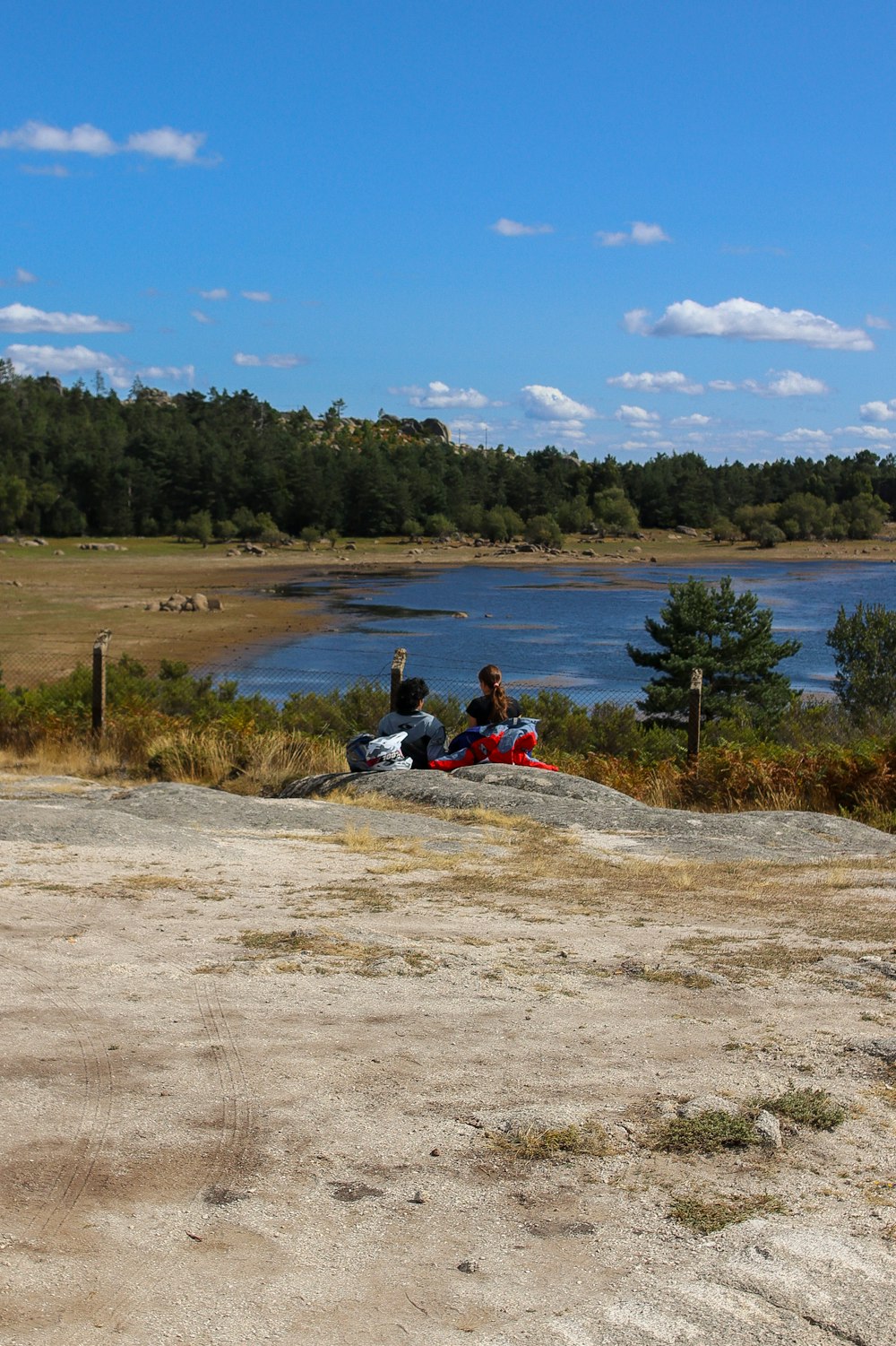 a couple of people sitting on top of a motorcycle