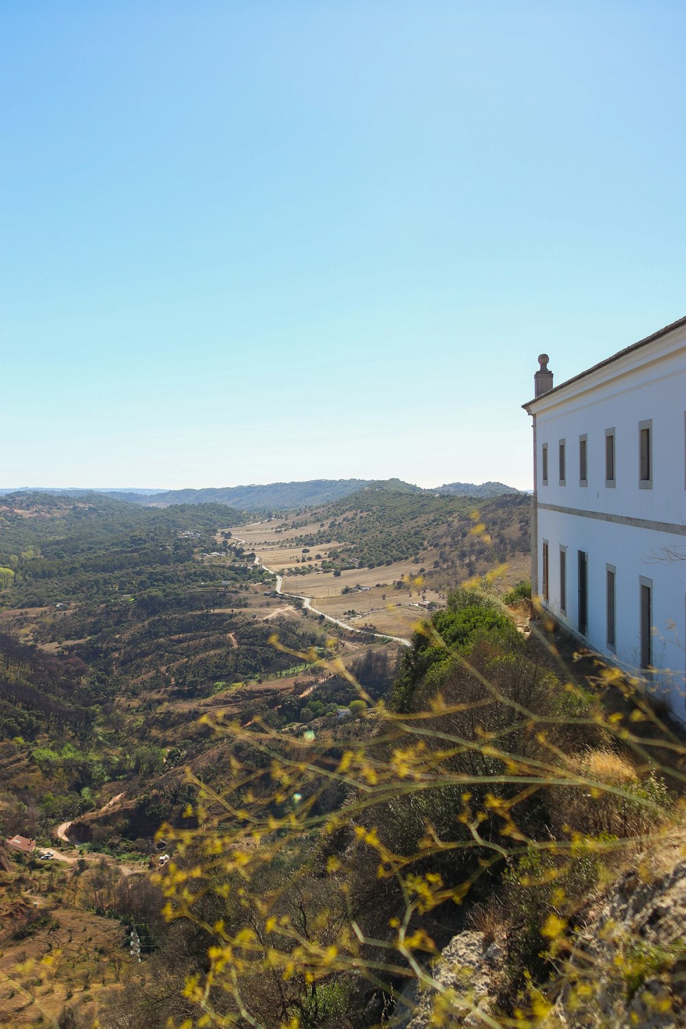 a house on a hill overlooking a valley