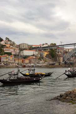 a couple of boats floating on top of a body of water