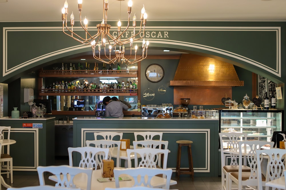 a restaurant with a chandelier hanging from the ceiling