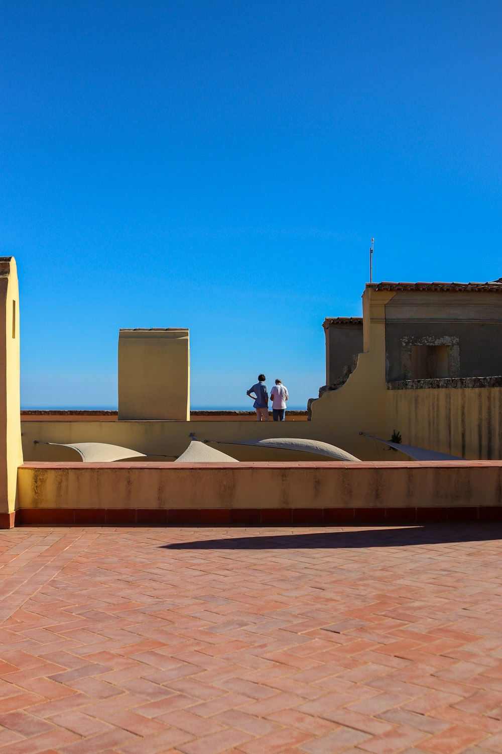 a man riding a skateboard on top of a roof