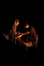 a group of people standing around each other