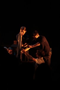 a group of people standing around each other