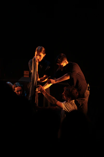 a group of people standing around each other