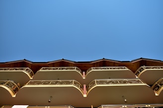 Exterior view of the Cielo Mar building with balconies overlooking the city.