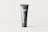 A sleek, gray tube stands vertically against a light background. The tube is primarily dark gray with 'black tube mockups' written in white text vertically. The letters 'MF' are prominently displayed at the top section of the tube.