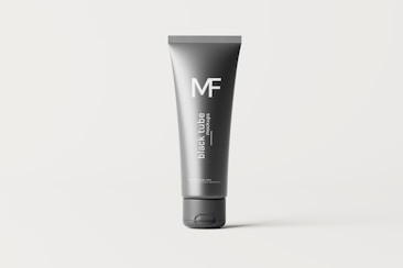 A sleek, gray tube stands vertically against a light background. The tube is primarily dark gray with 'black tube mockups' written in white text vertically. The letters 'MF' are prominently displayed at the top section of the tube.
