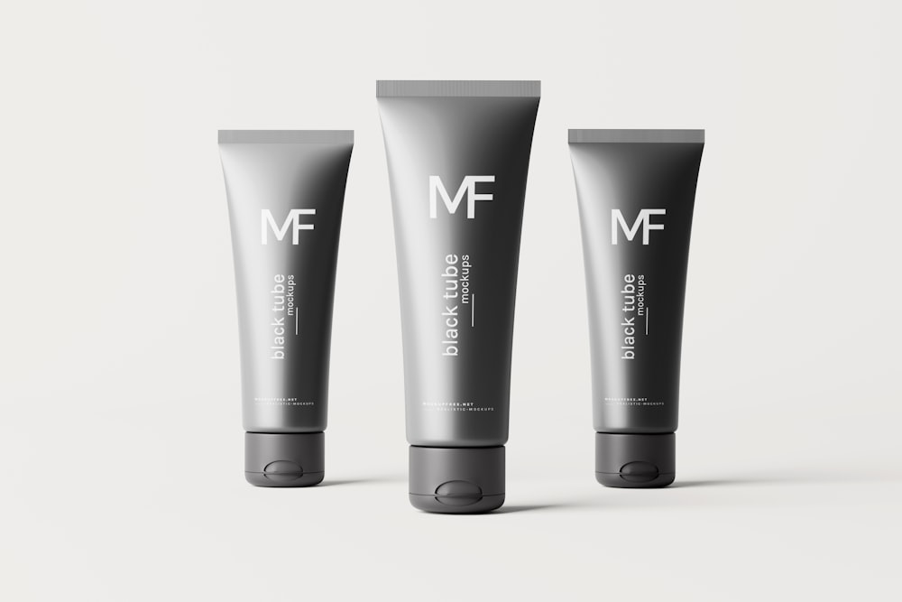 three tubes of mf cosmetics on a white background