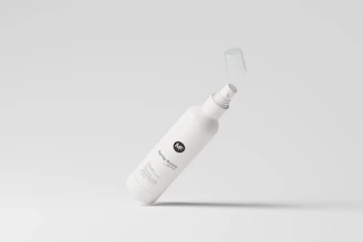 Close-up of a 1-liter insecticide bottle labeled 'Silver' with a green and blue design on a clean white background