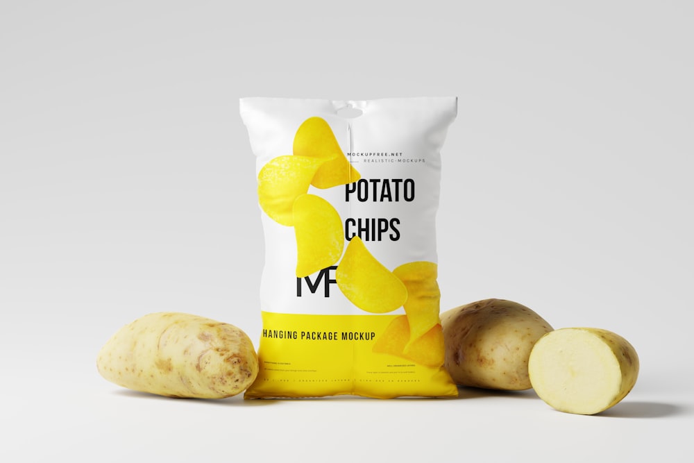 a bag of potato chips next to two potatoes