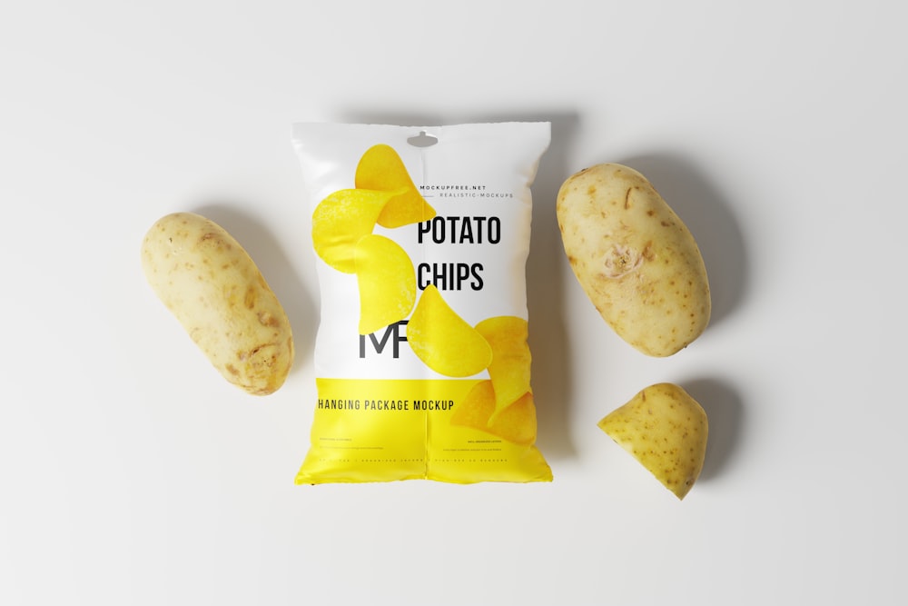 a bag of potato chips next to three pieces of potato