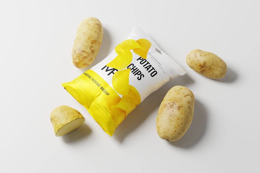 a bag of potato chips next to a potato peel