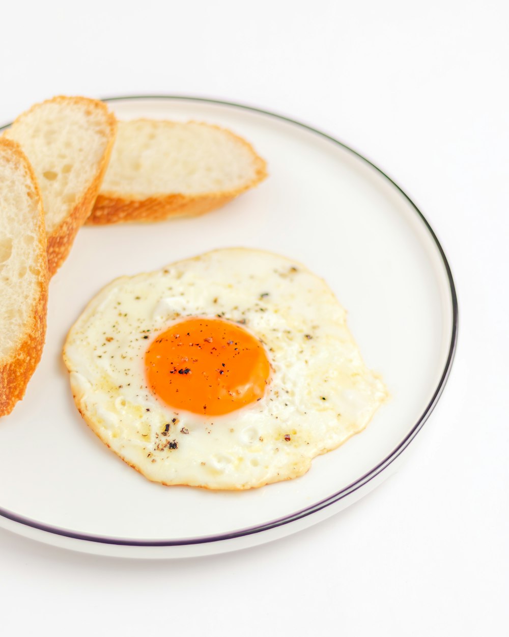 a fried egg and toast on a plate