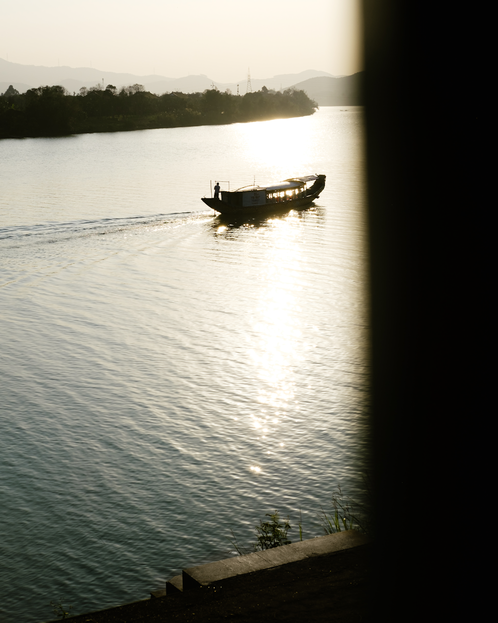 a small boat traveling across a large body of water