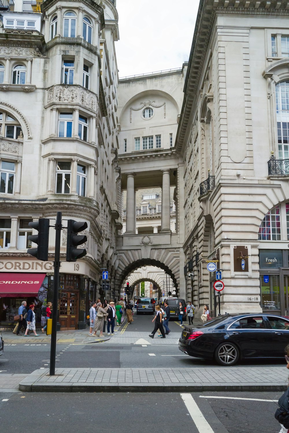 a busy city street with cars and pedestrians