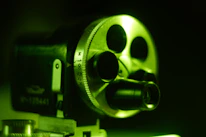 Close-up of a vintage film camera capturing a poignant moment during a shoot.