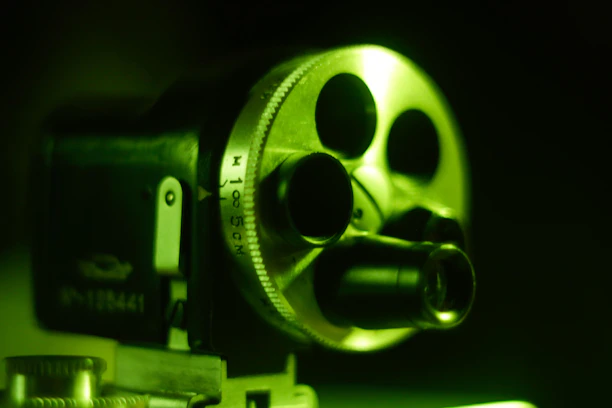 A close-up of a vintage film camera capturing a cinematic moment during a shoot.