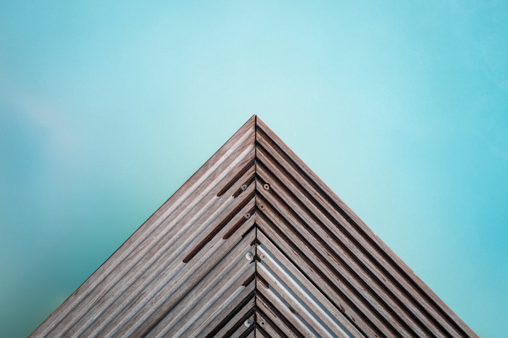 the top of a building with a blue sky in the background