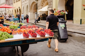 A vibrant farmers market scene in downtown Santa Barbara with locals browsing fresh produce.