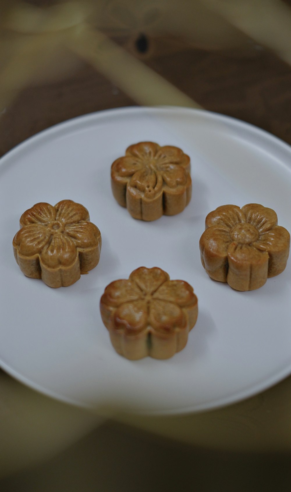 a white plate topped with four small cakes