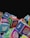 A collection of colorful cubes stacked together, each with the logo of a popular social media platform such as Twitter, Instagram, Facebook, and WhatsApp. The cubes are arranged in a way that they appear to be tumbling or piled up.
